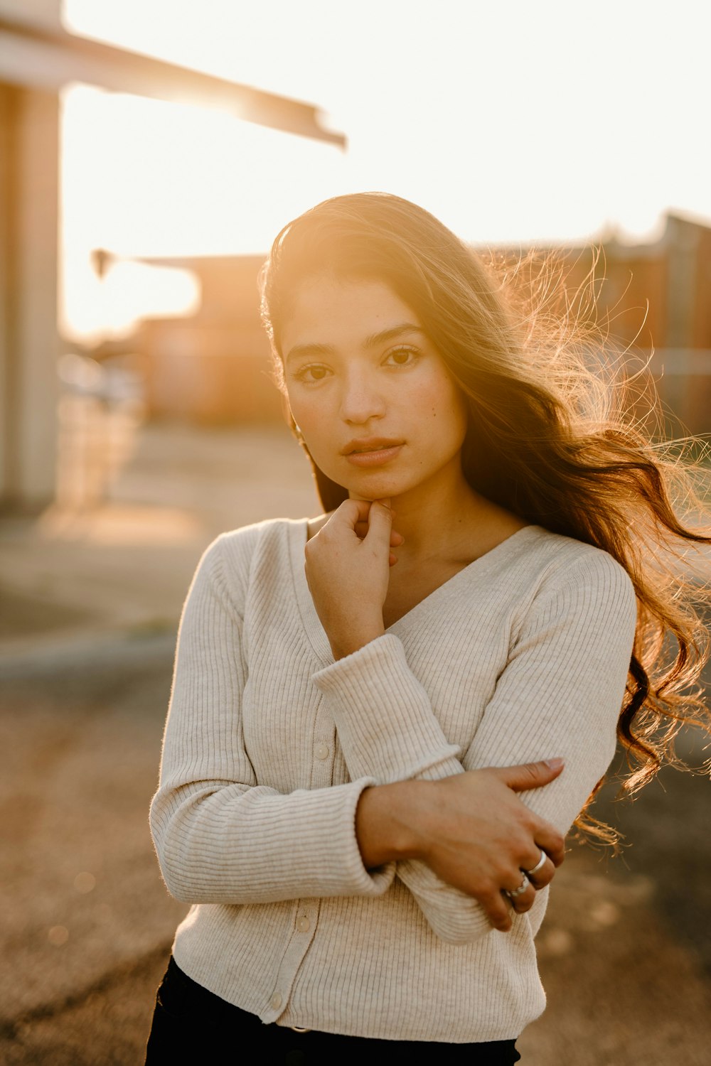 a woman with her hand on her chin