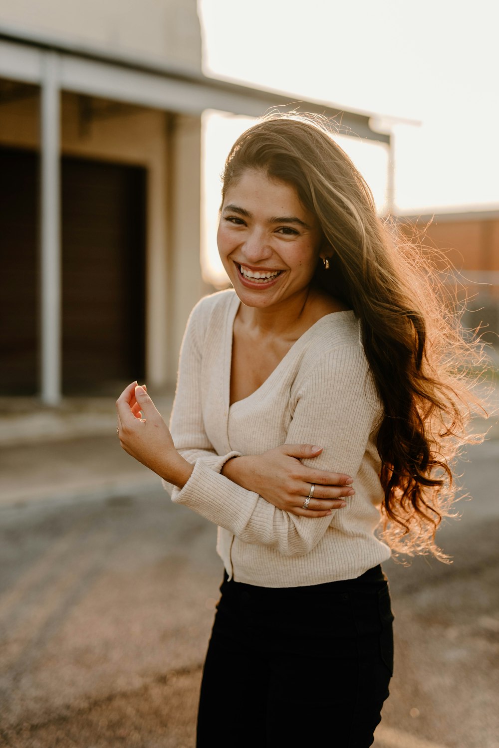 a woman with her arms crossed