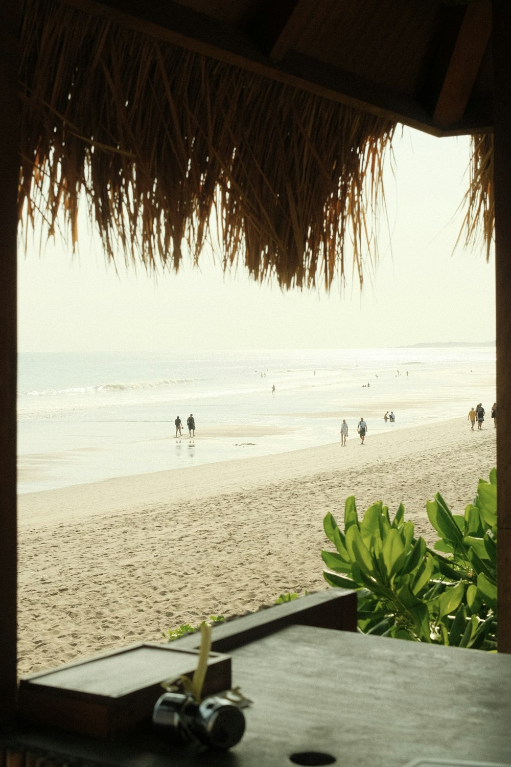 a beach with people walking on it