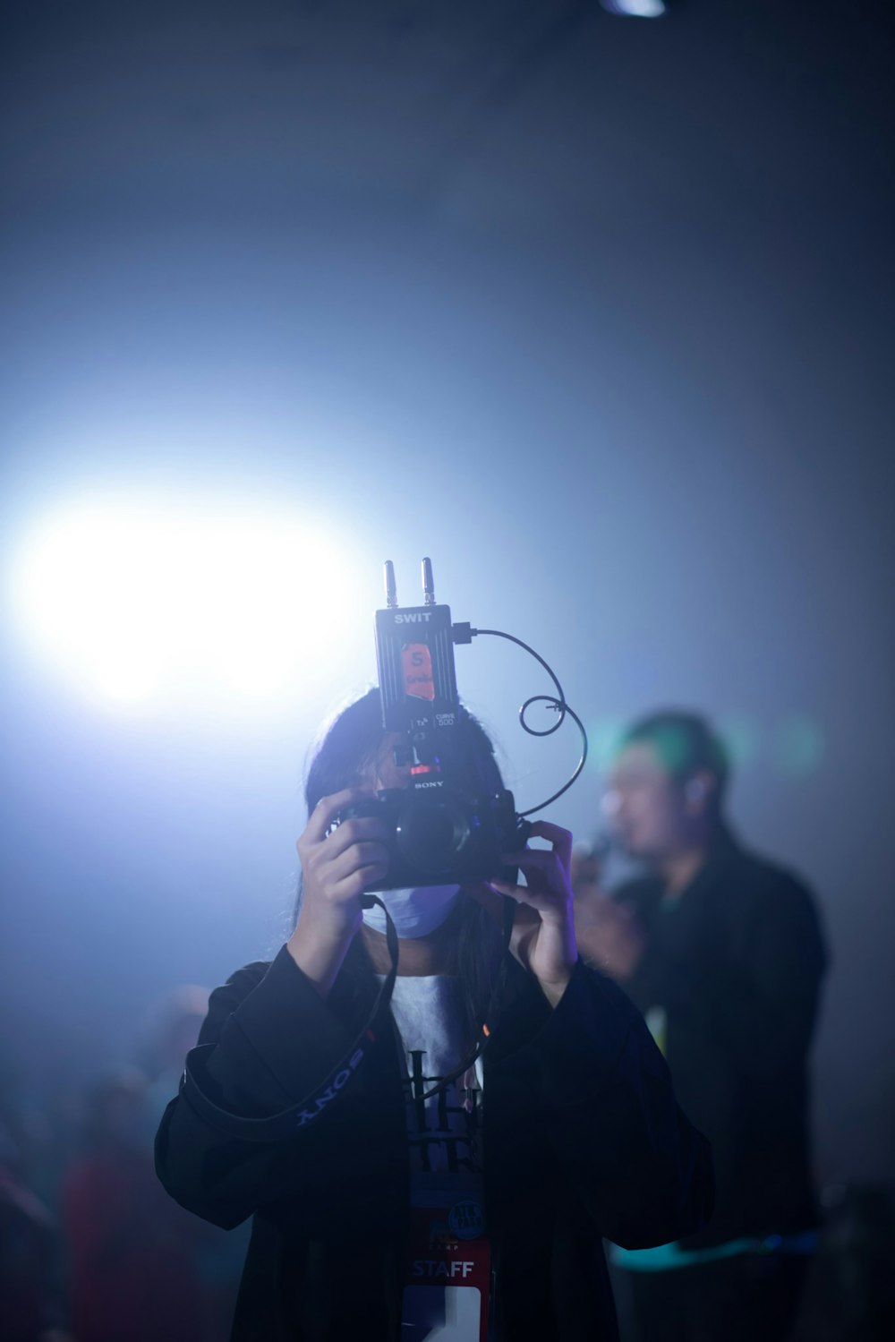 a person holding a camera up to their face