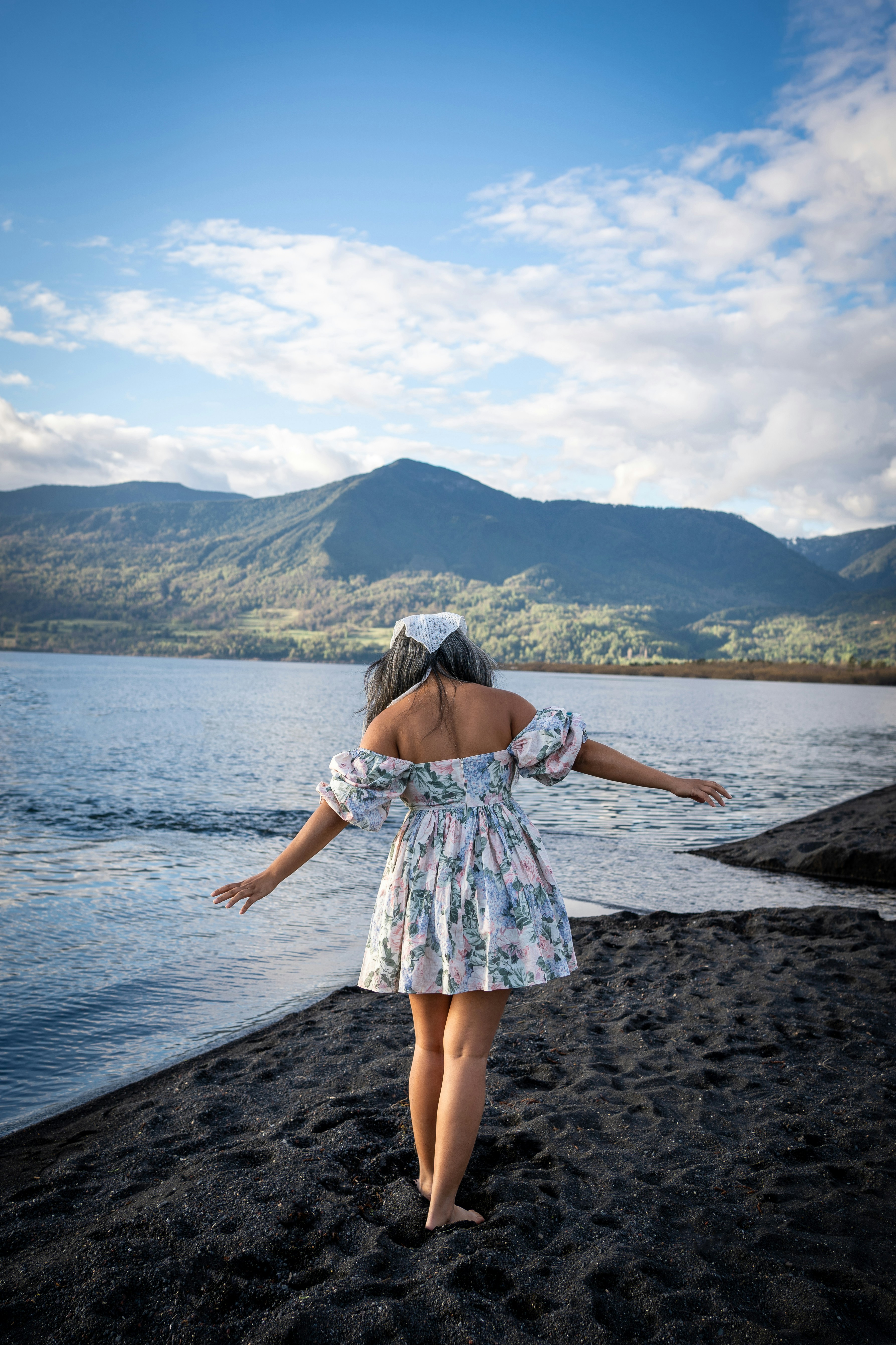 a girl standing on a beach