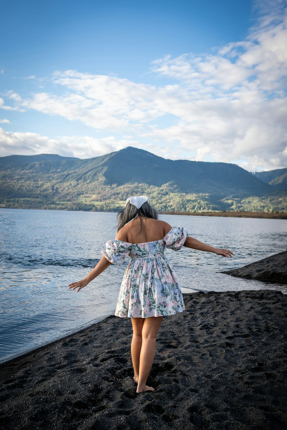 a girl standing on a beach