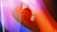 A silhouette of a person, possibly a woman, wearing glasses is seen against a vibrant abstract background of flowing colors including purple, pink, and orange. The scene has an ethereal and dreamy quality.