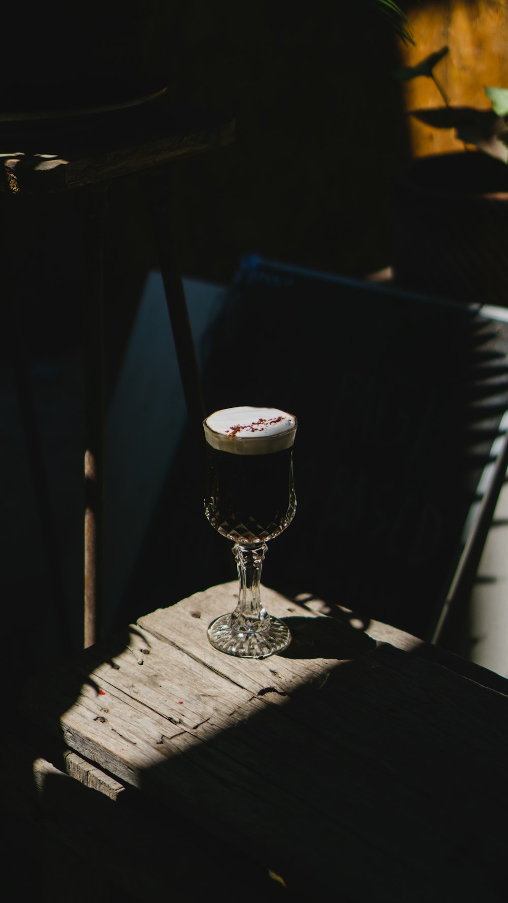 a glass of beer on a table