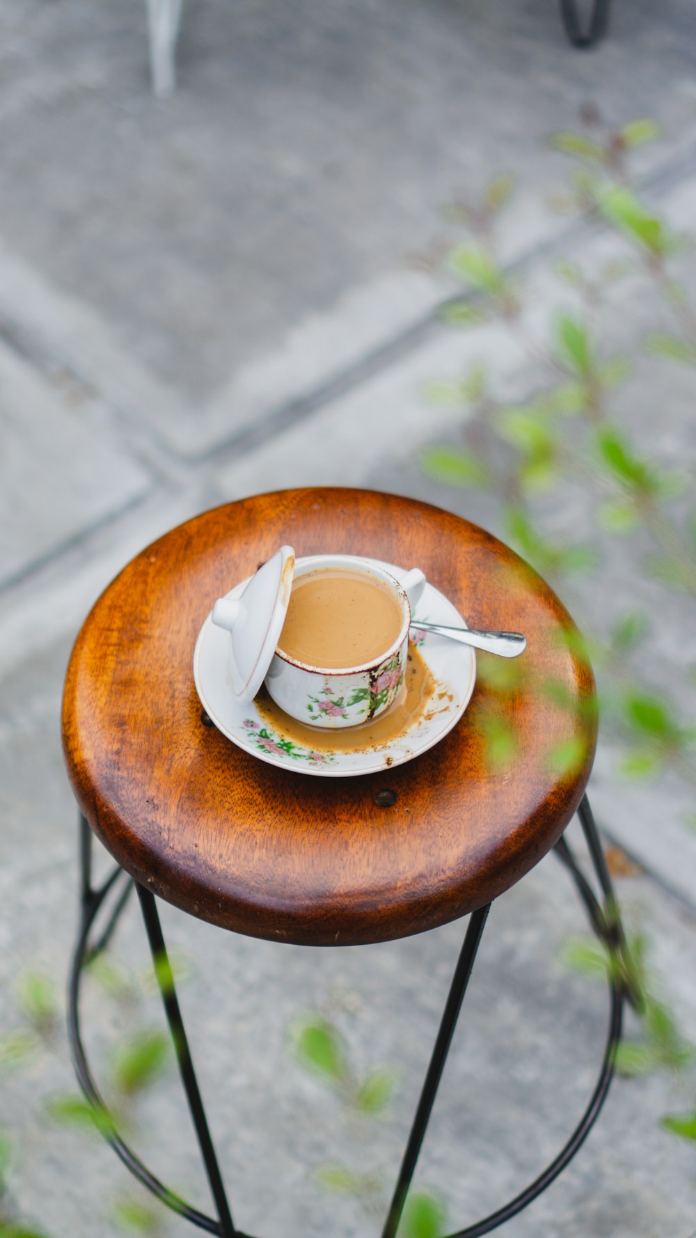 a cup of coffee on a wooden table