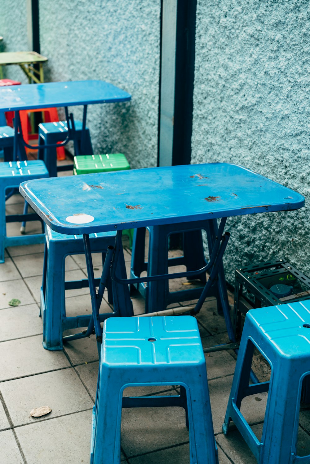 a group of blue tables