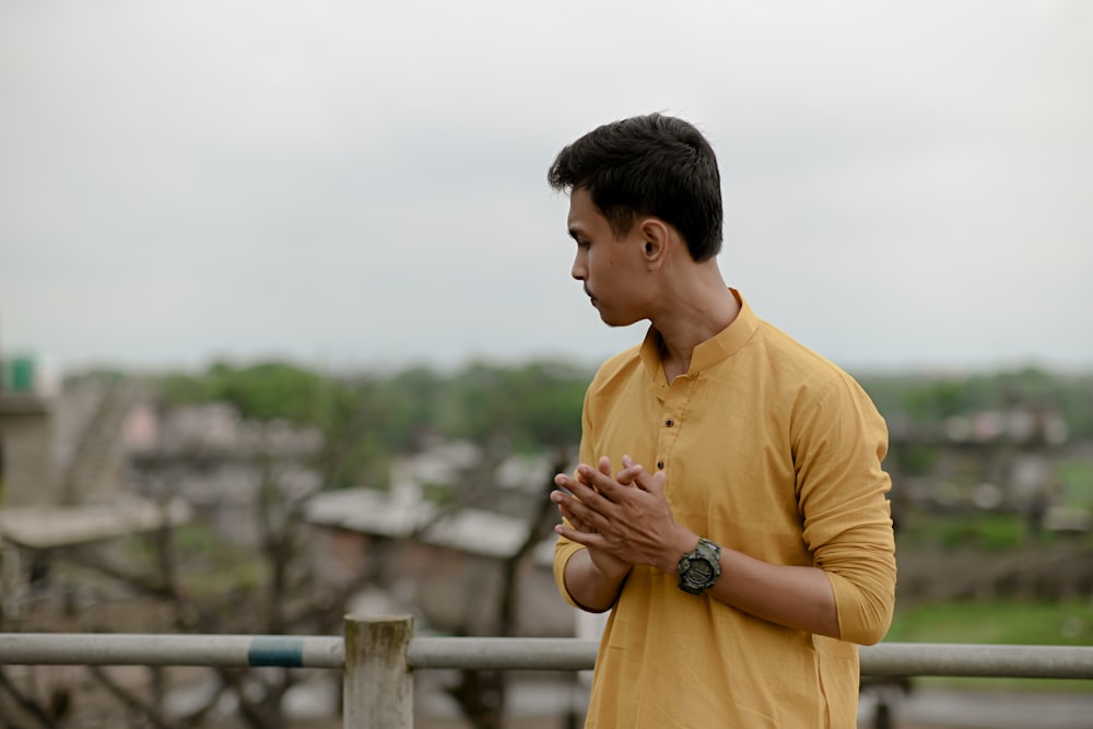 a man standing on a balcony