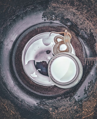 Drain snake coiled and ready beside a clean, clear drain opening