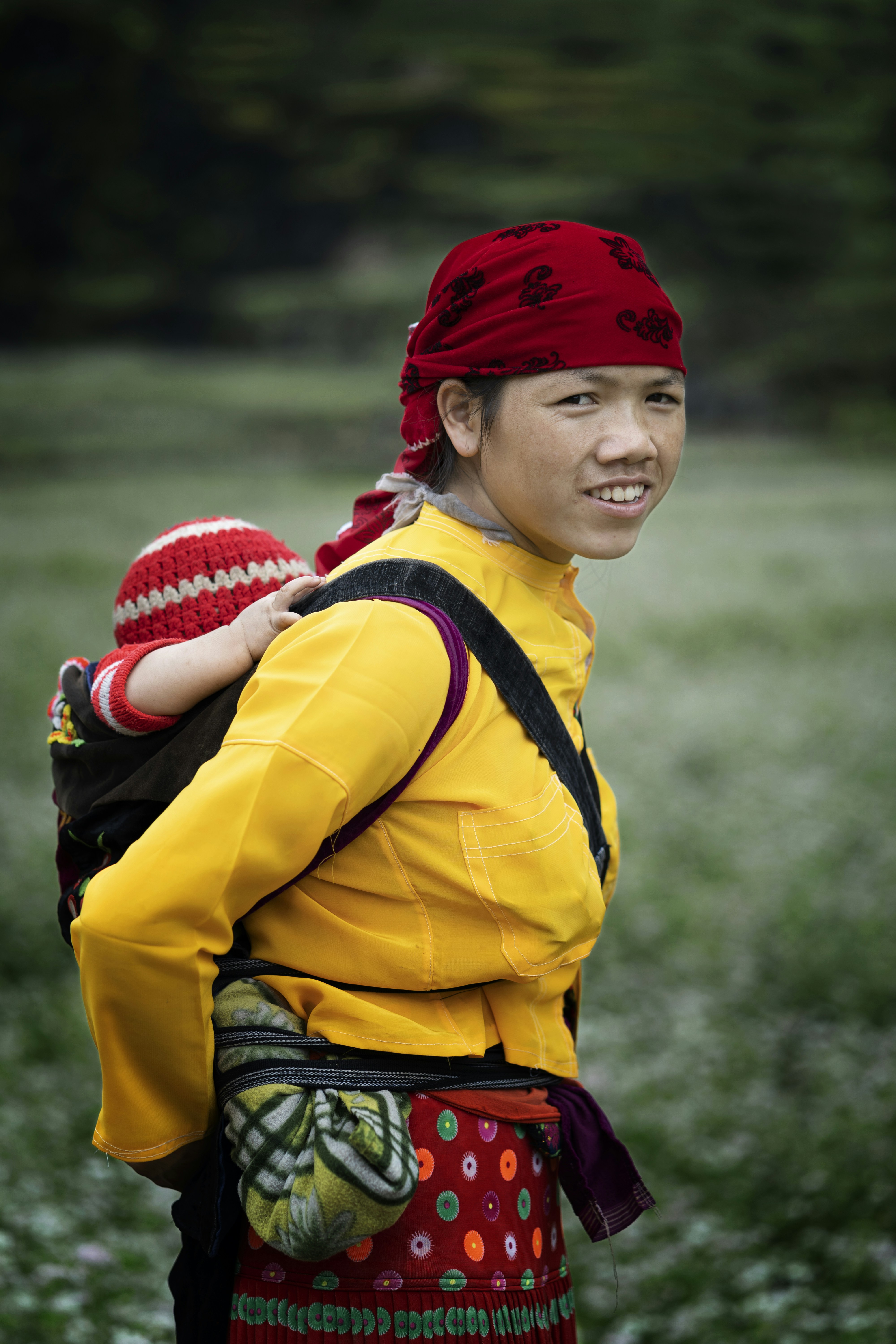 a person carrying a baby