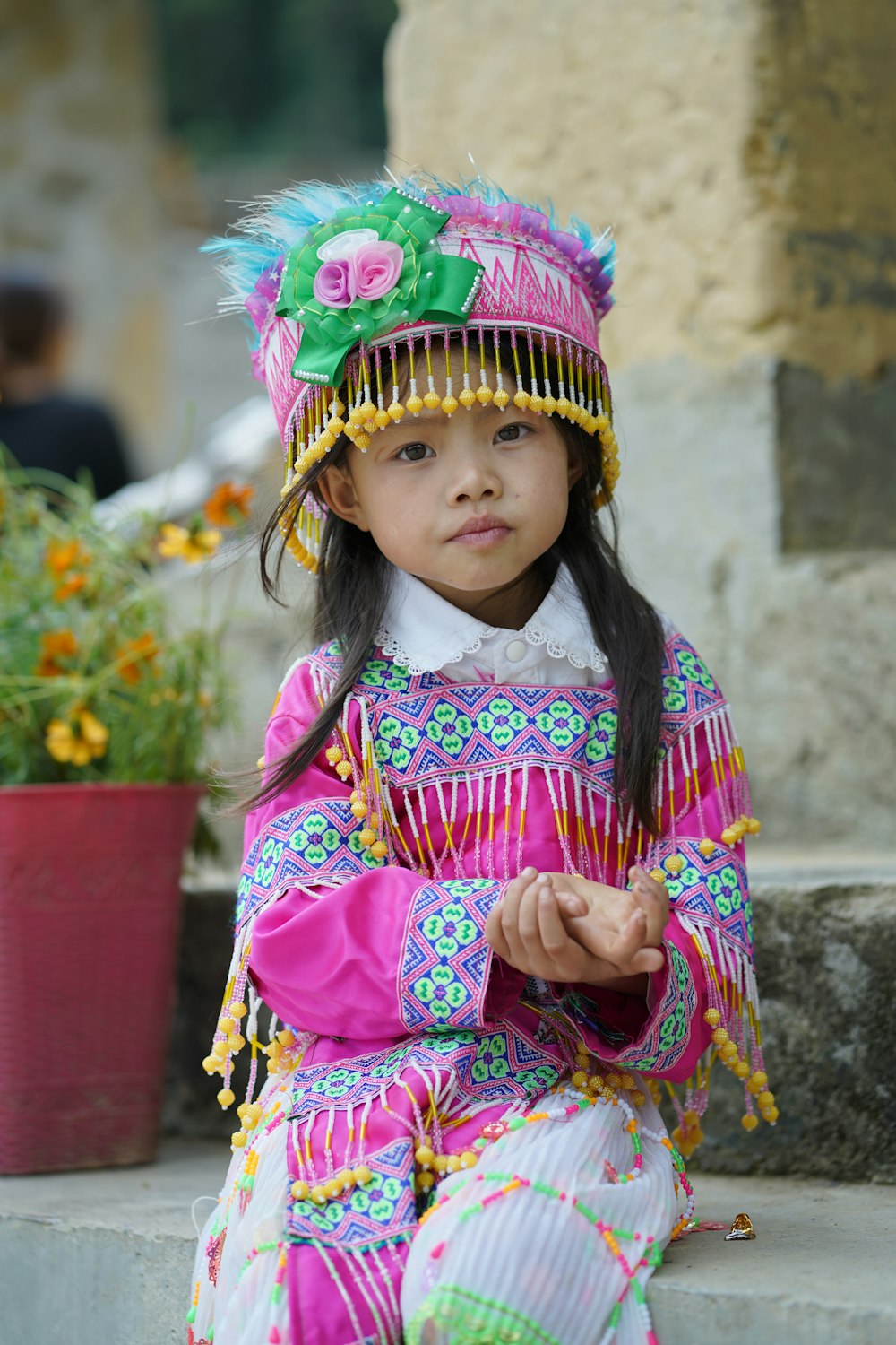 a girl wearing a colorful dress