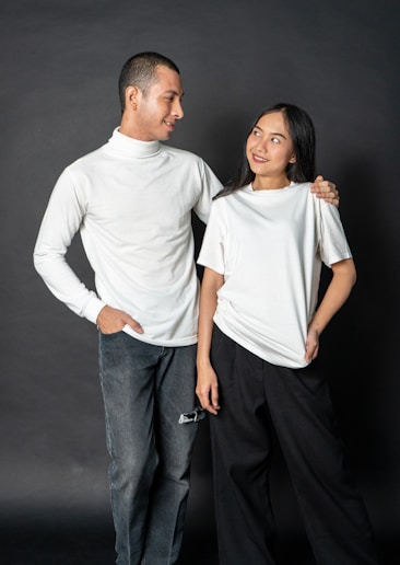 a man and a woman standing next to each other and smiling