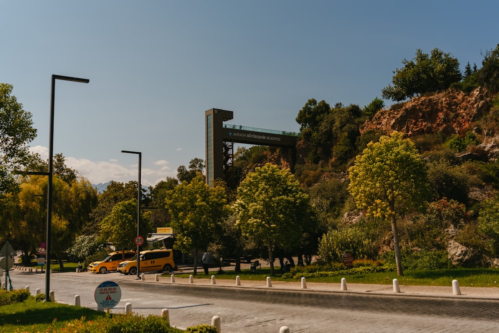 a yellow truck driving down a road