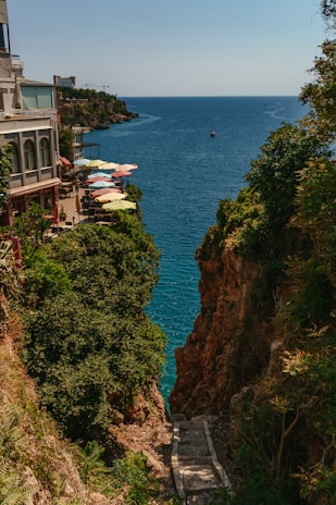 a body of water with buildings and trees around it