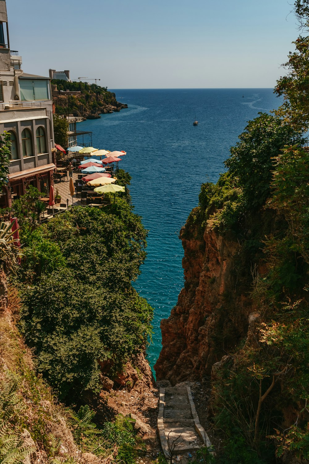 a body of water with buildings and trees around it