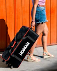 a woman holding a black bag
