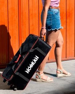 a woman holding a black bag