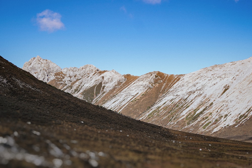 a rocky mountain with snow