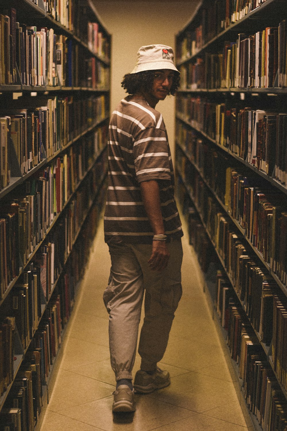 a man standing in a library