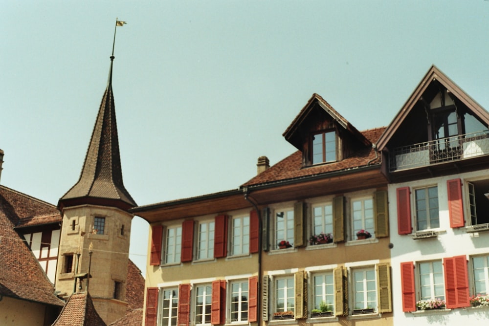 a row of buildings with a steeple