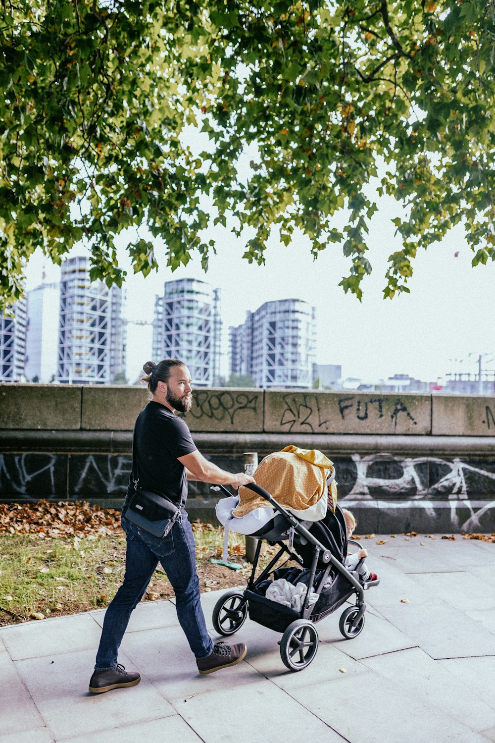 a man pushing a stroller