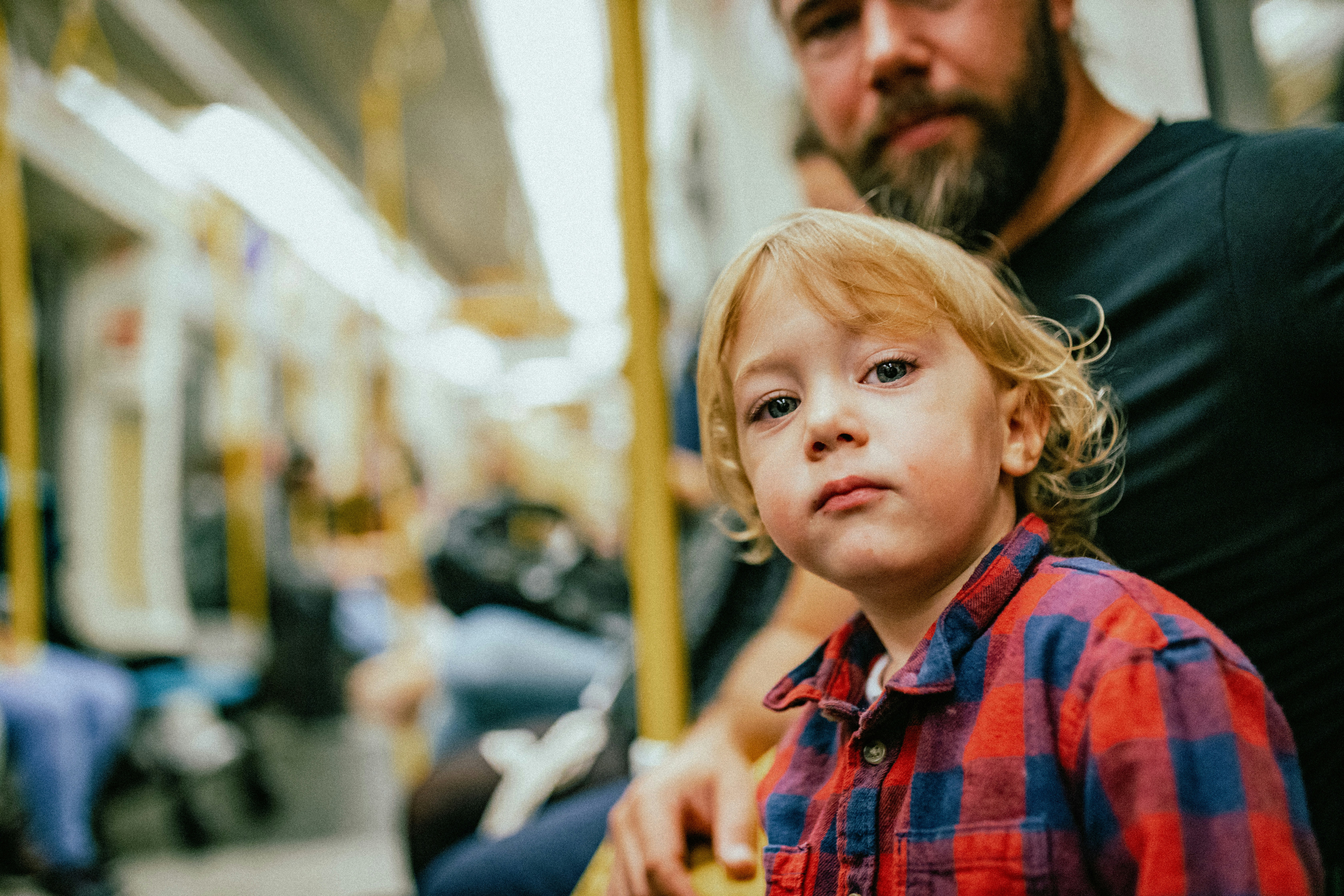 a young girl with a person in the background