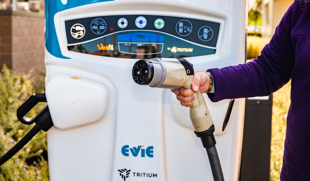 a person using a gas pump