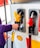 A happy customer refueling at Shell gas station.