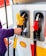 A happy customer refueling at Shell gas station.