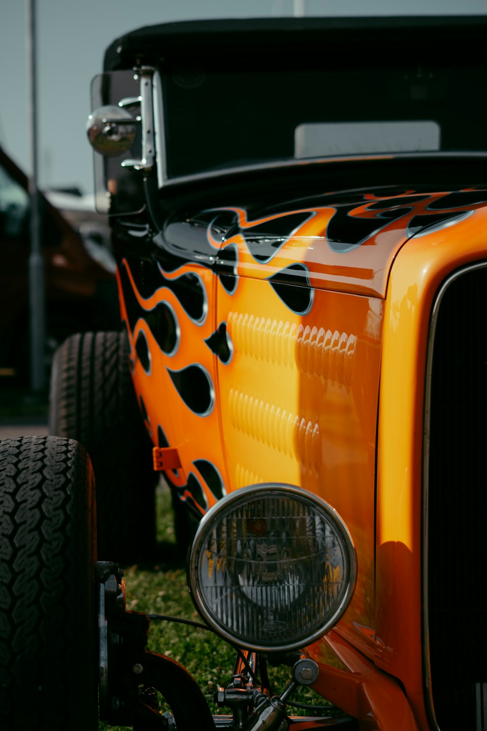 a yellow car with a black rim