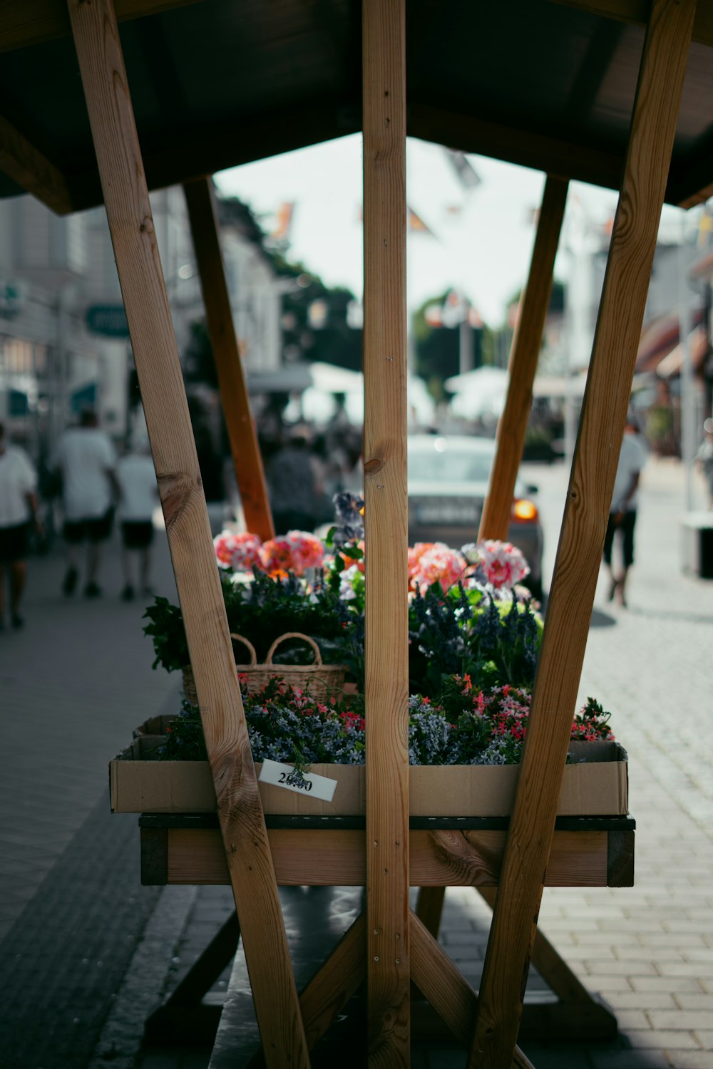 a wooden bench with flowers