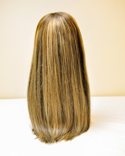a wig topper on a mannequin