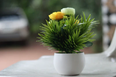 Close-up of realistic artificial plants arranged in stylish home decoration.