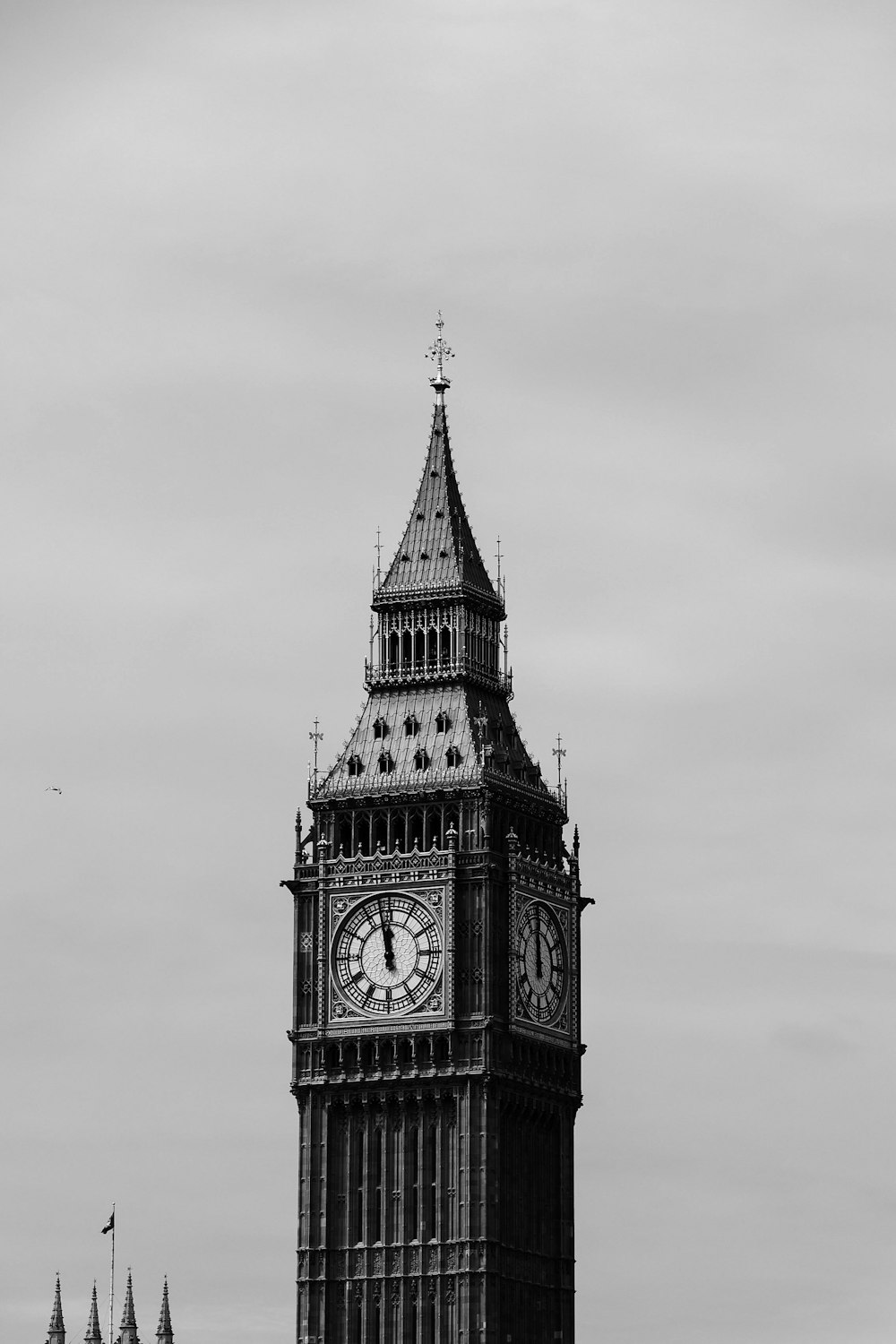 a clock tower with a weather vane