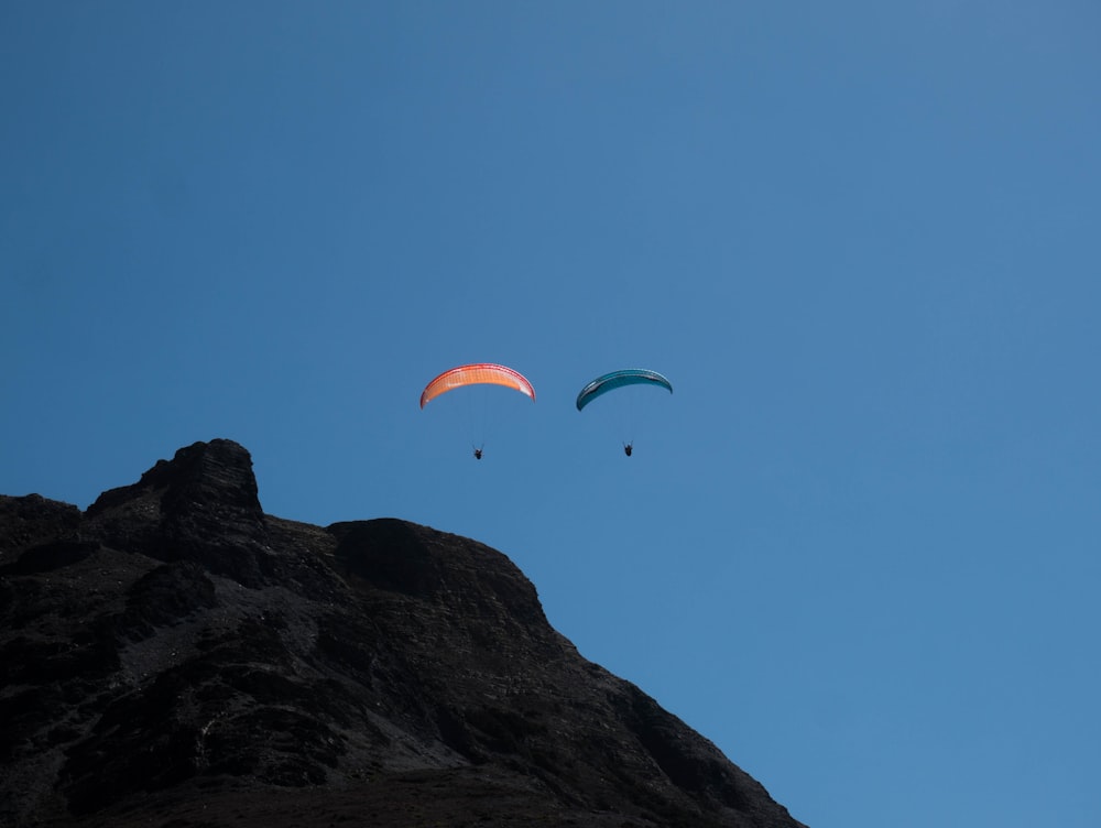a couple of people parachuting