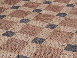a brick walkway with a pattern