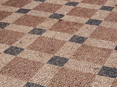 a brick walkway with a pattern