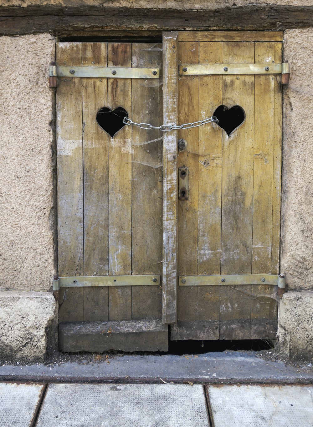 a wooden door with a hole in it