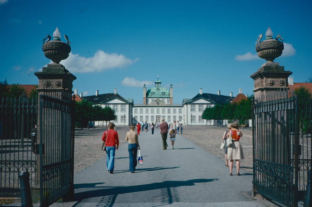 people walking on a sidewalk