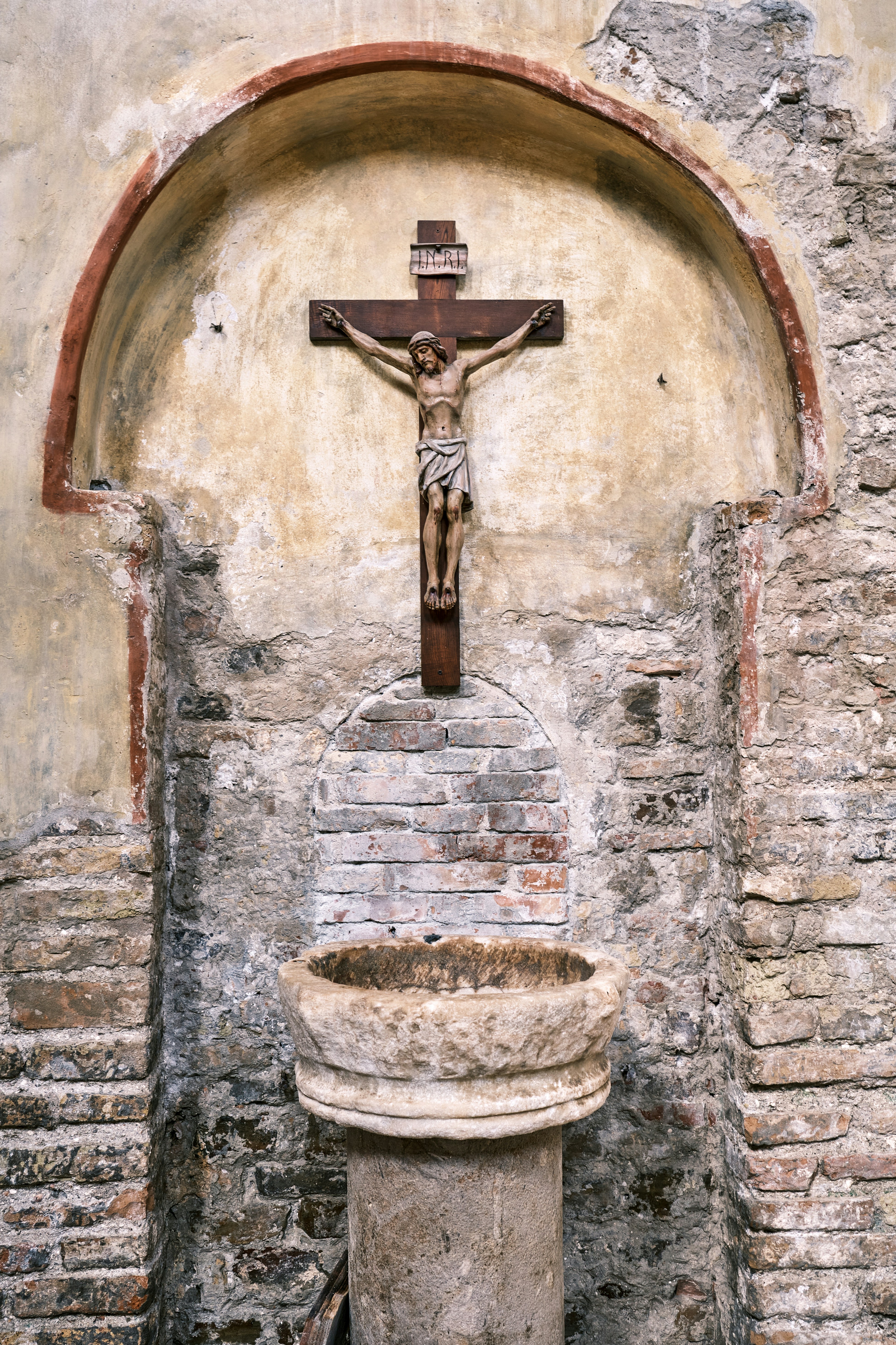 a statue in a stone building