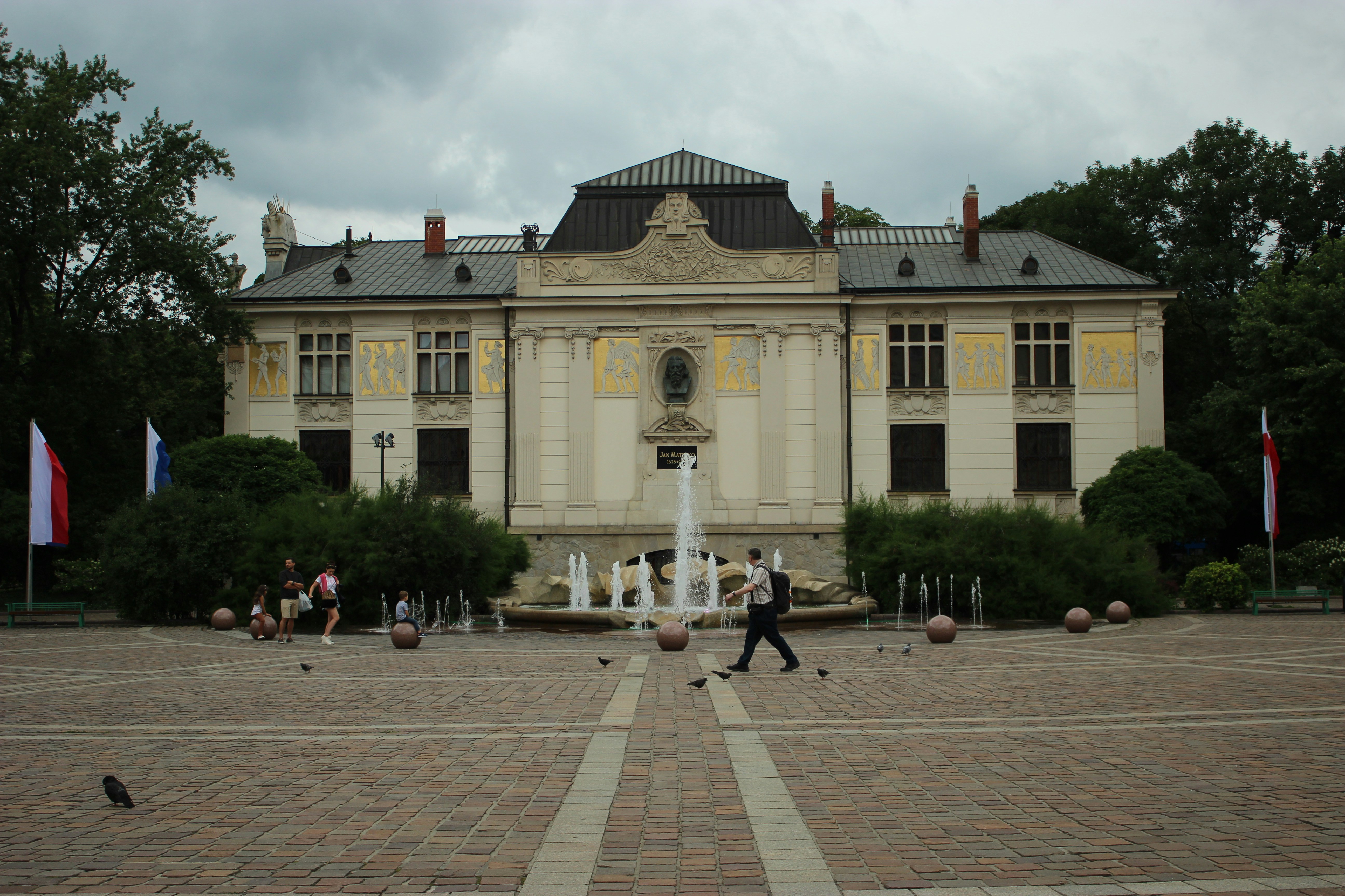 a building with a fountain in front