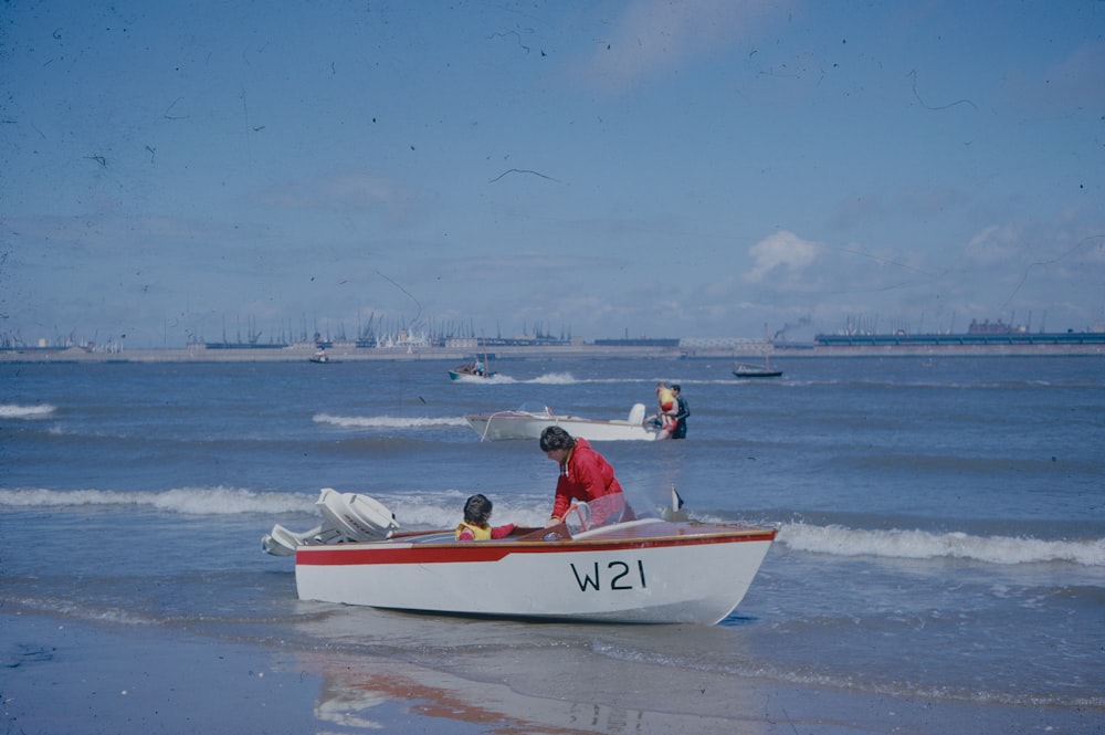 a person and a child in a boat on the water