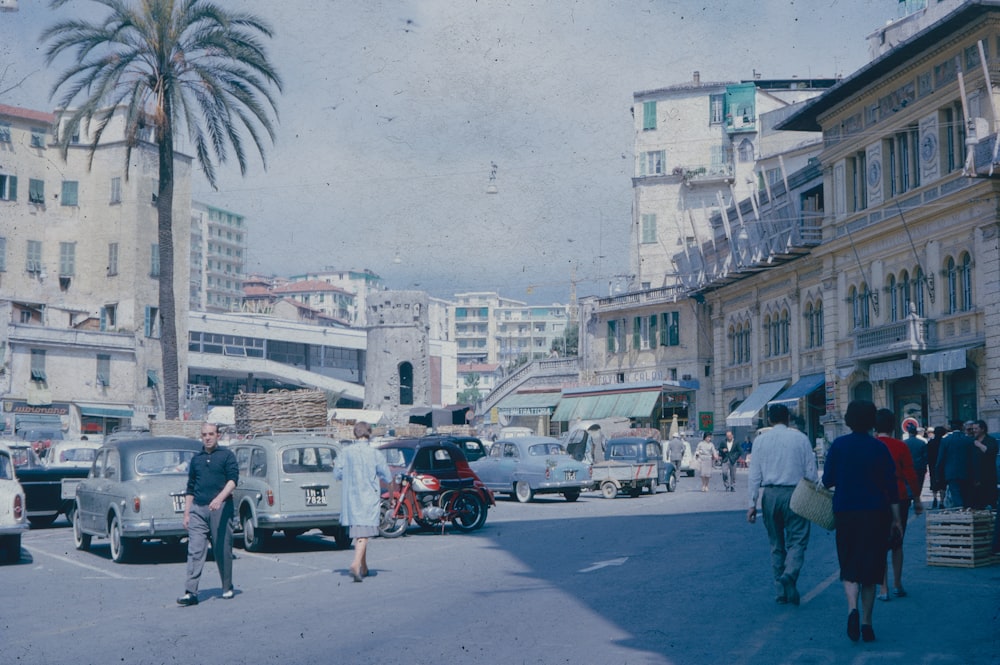 a busy street with cars and people