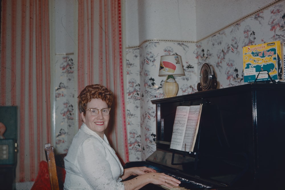 a person sitting at a piano