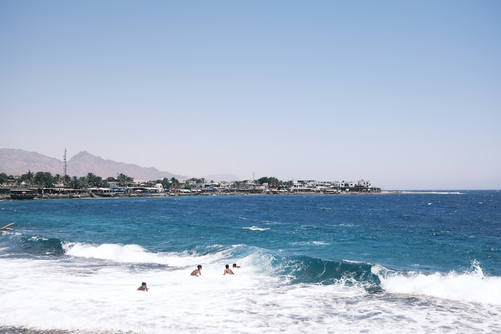 people swimming in the ocean