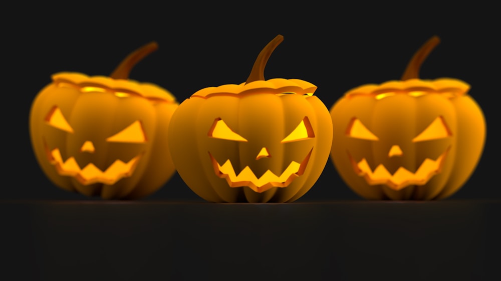 a group of carved pumpkins