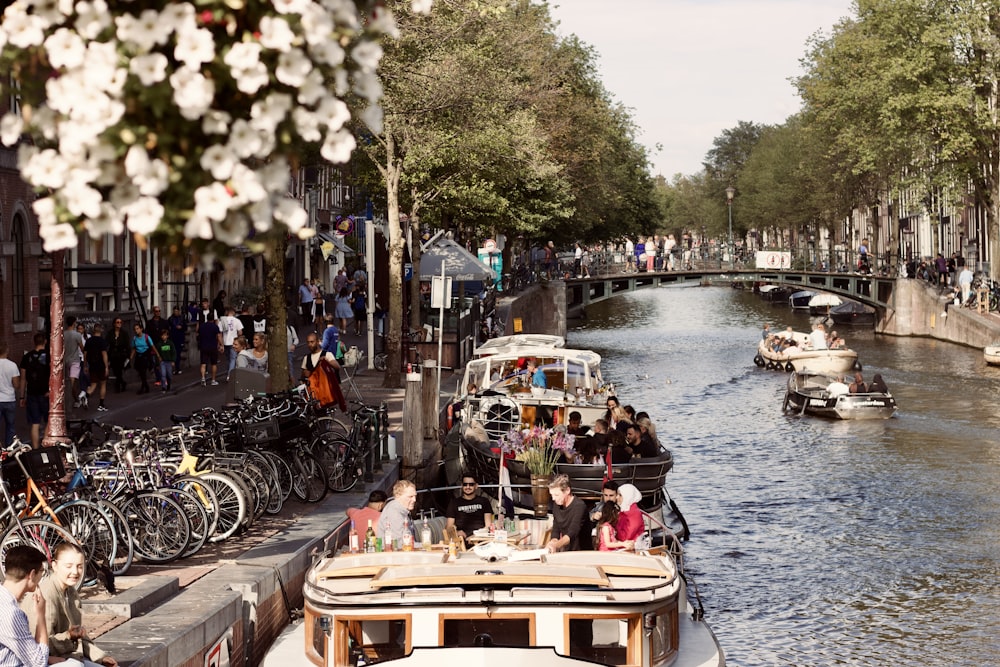 a group of people ride on boats