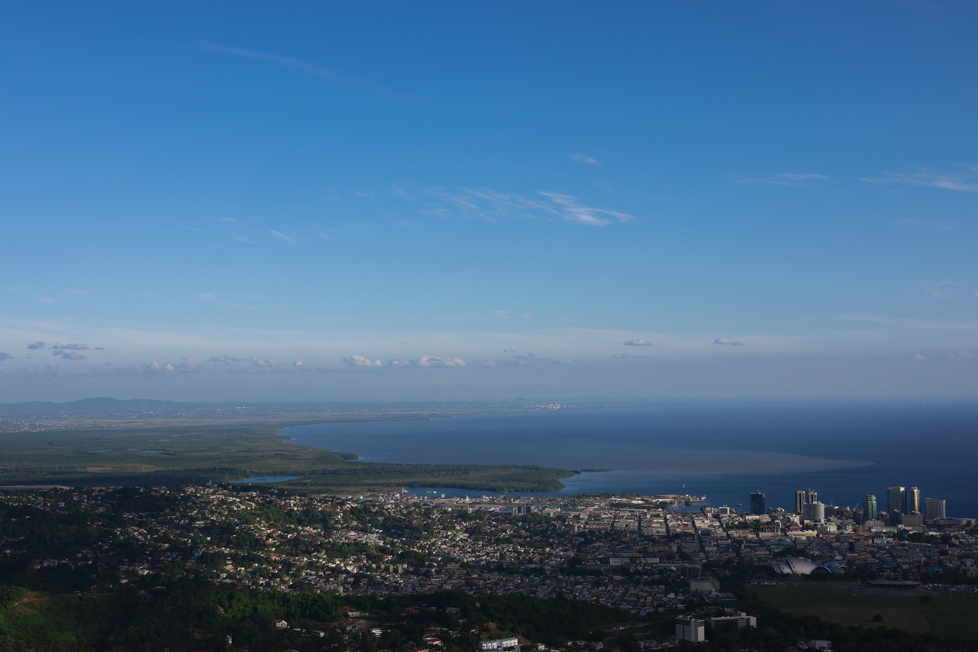 a city with a body of water in the background