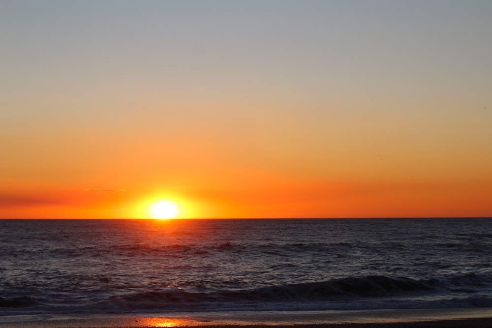 a sunset over the ocean