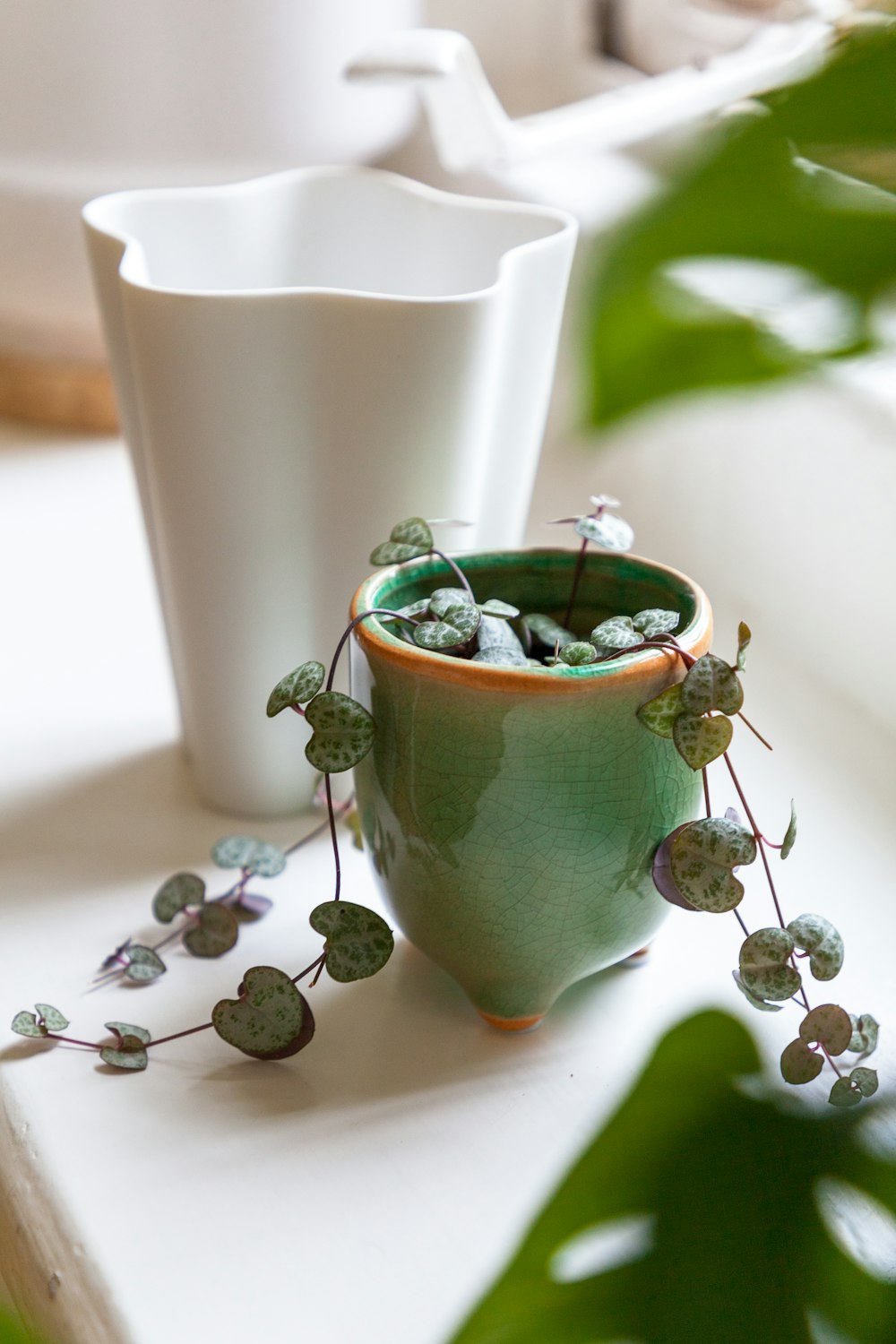 a cup of tea and a teapot on a table