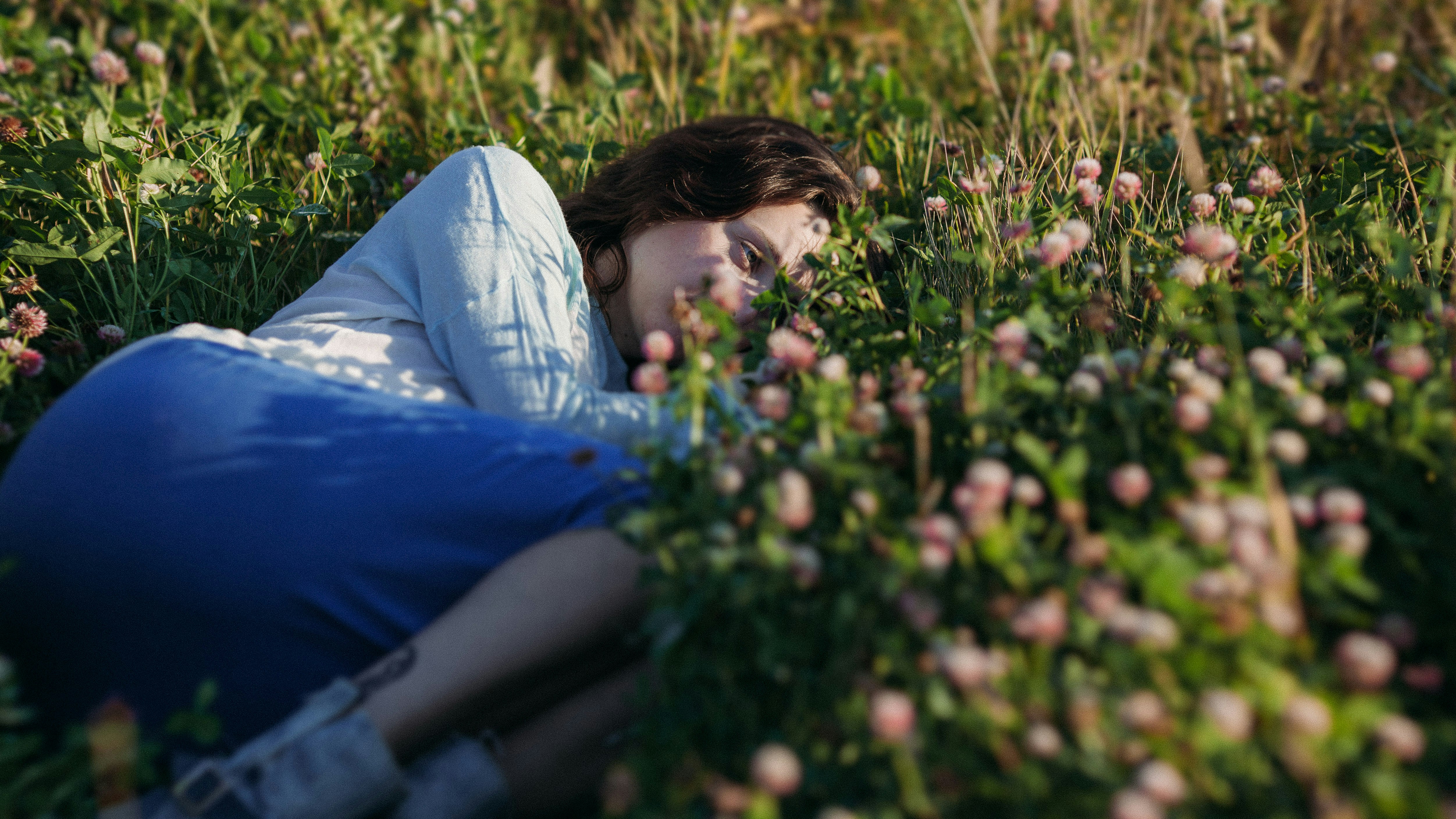 a person lying in the grass